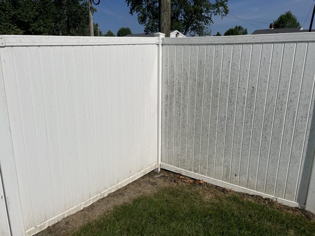 Vinyl fence cleaning along a property line in Lima, Ohio